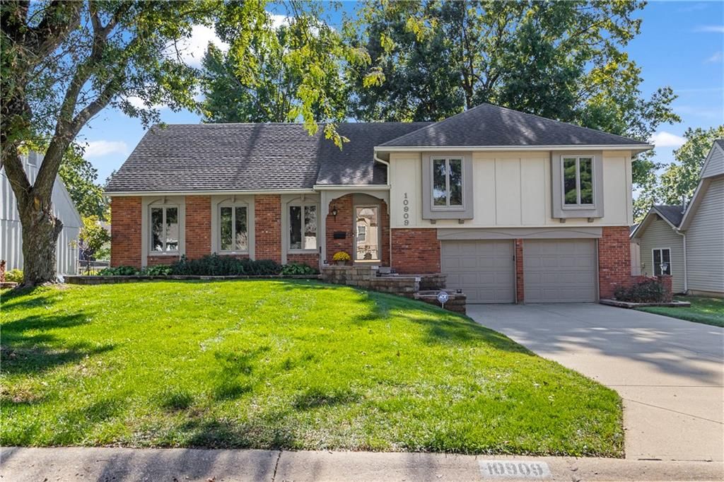 Brick exterior, traditional style and attached garage at 10909 W 102nd Street, Overland Park, KS 66214