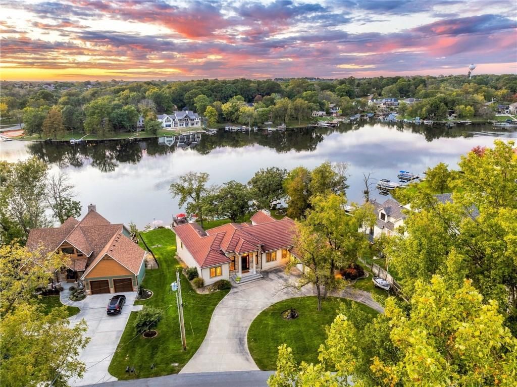 Mature trees and driveway at 7810 NW Scenic Drive, Weatherby Lake, MO 64152