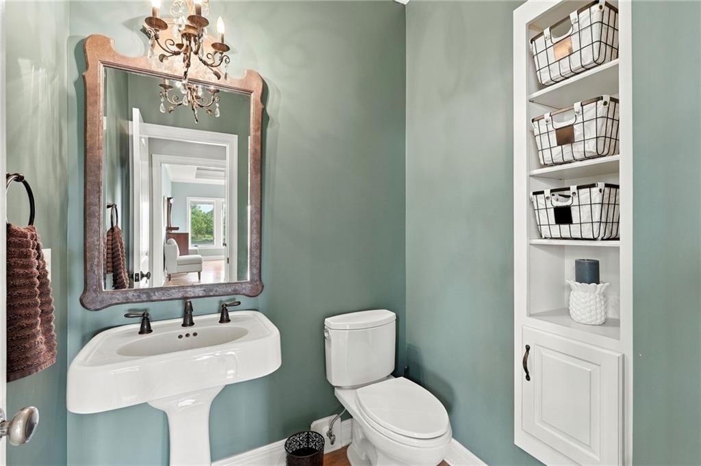 White vanity and renovated bathrooms at 7810 NW Scenic Drive, Weatherby Lake, MO 64152