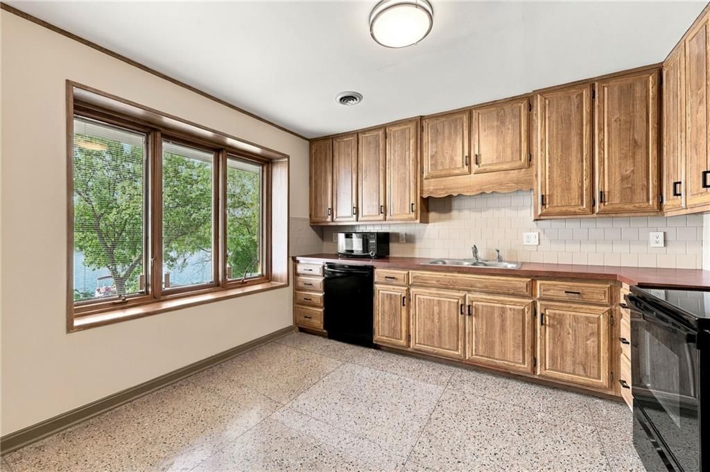 Second kitchen and wood kitchen cabinets at 7810 NW Scenic Drive, Weatherby Lake, MO 64152