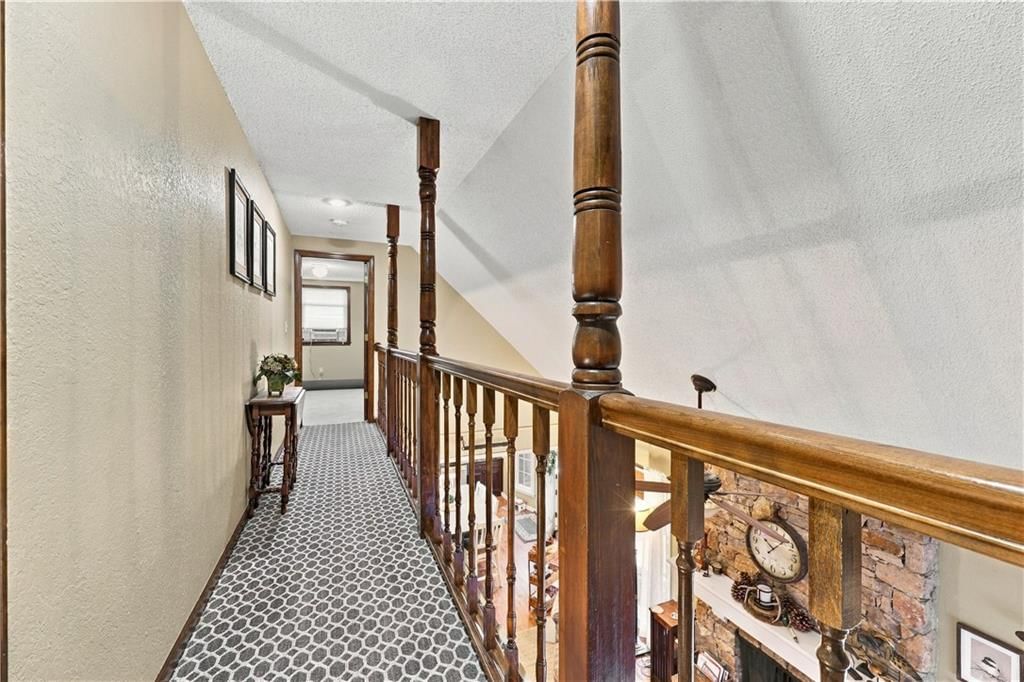 Staircase and wood stair railing at 12908 E 58th Street, Kansas City, MO 64133