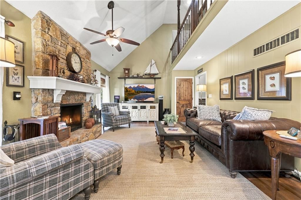 Tall ceilings, fireplace and statement lighting at 12908 E 58th Street, Kansas City, MO 64133