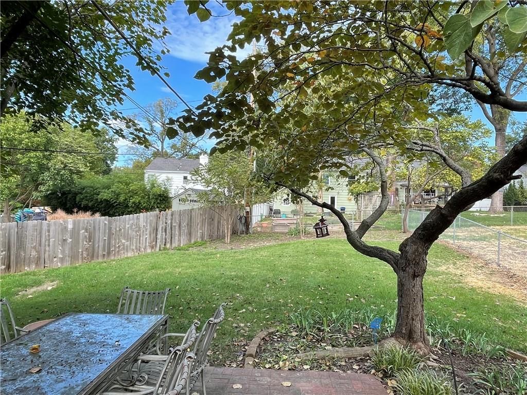 Big backyard, fenced yard and mature trees at 6926 W 101st Street, Overland Park, KS 66212