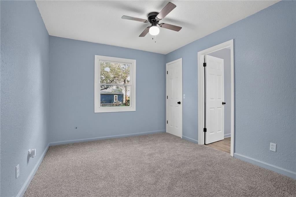 Blue main wall color and carpet at 6202 E 147th Terrace, Grandview, MO 64030