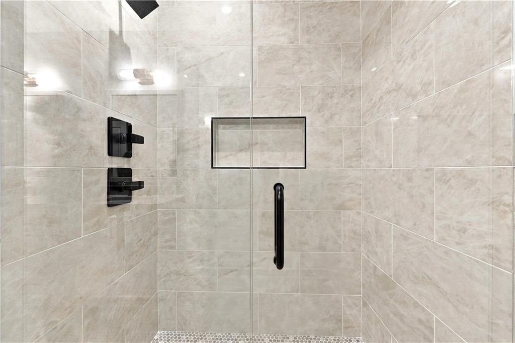 Walk-in shower, tiled shower and frameless glass shower at 2730 S 37th Street, Kansas City, KS 66106