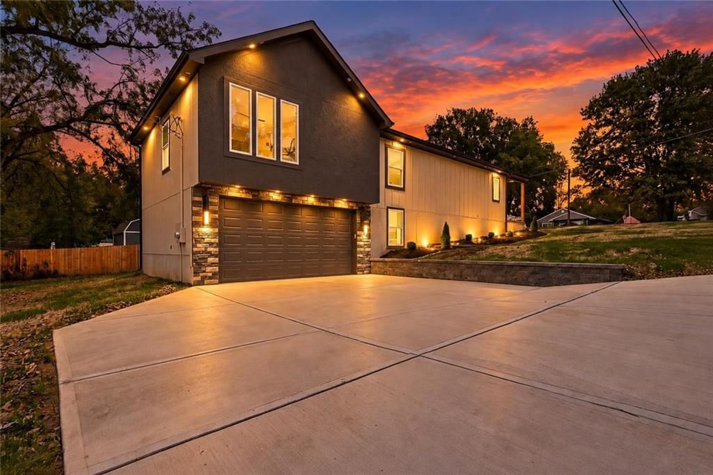 Fenced yard, attached garage and concrete driveway at 2730 S 37th Street, Kansas City, KS 66106