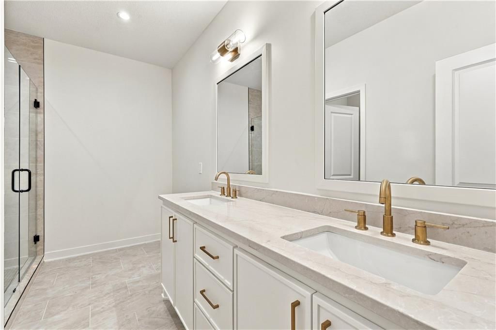 Double vanity, white vanity and renovated bathrooms at 2730 S 37th Street, Kansas City, KS 66106