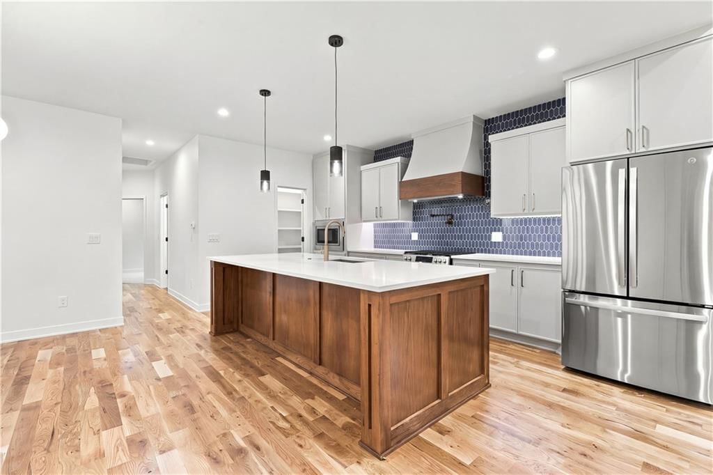 Quartz counters, kitchen backsplash and mosaic tile backsplash at 2730 S 37th Street, Kansas City, KS 66106