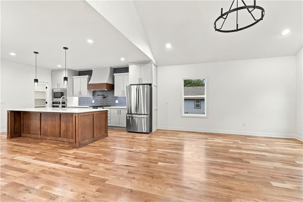 Tall ceilings, open floor plan and kitchen island at 2730 S 37th Street, Kansas City, KS 66106