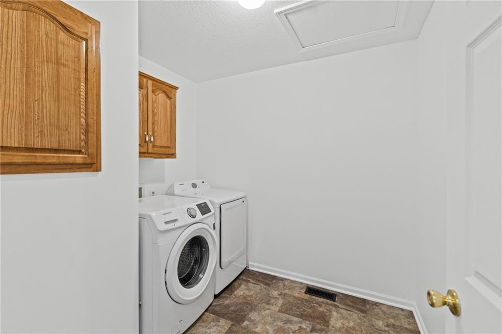Laundry cabinets at 29408 Vickie Drive, Excelsior Springs, MO 64024