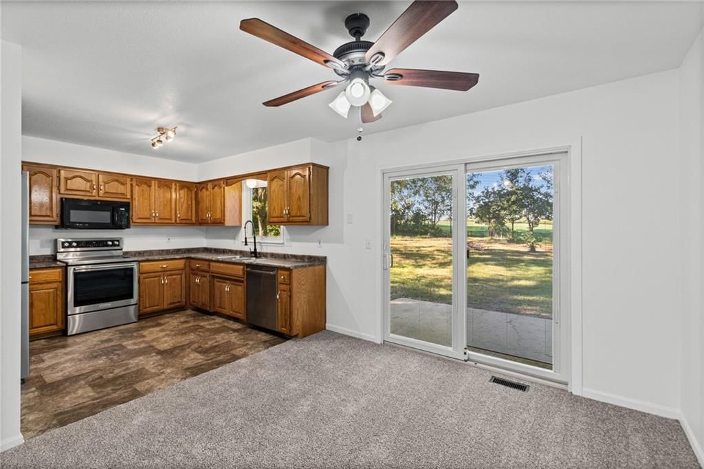 Tile floors, stainless steel appliances and wood kitchen cabinets at 29408 Vickie Drive, Excelsior Springs, MO 64024