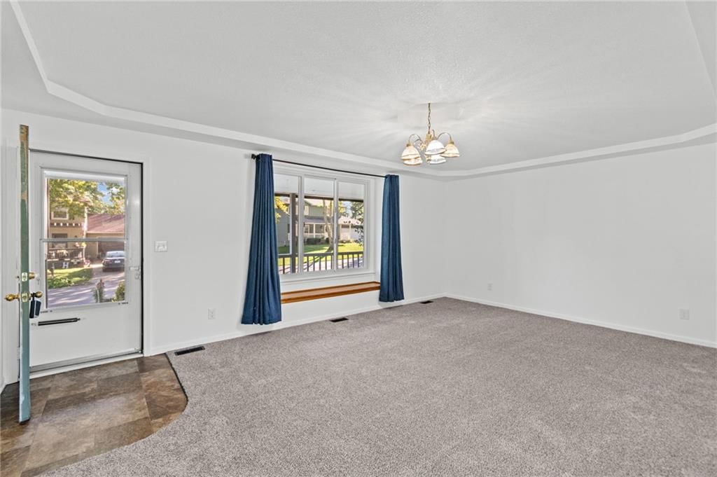 Wall of windows, recessed lighting and carpet at 29408 Vickie Drive, Excelsior Springs, MO 64024