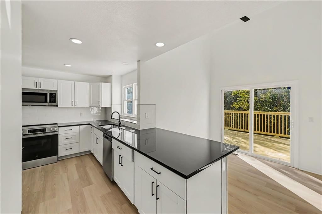 Photo 7: white kitchen cabinets, 6482 NW Valley Drive, Kansas City, MO 64152