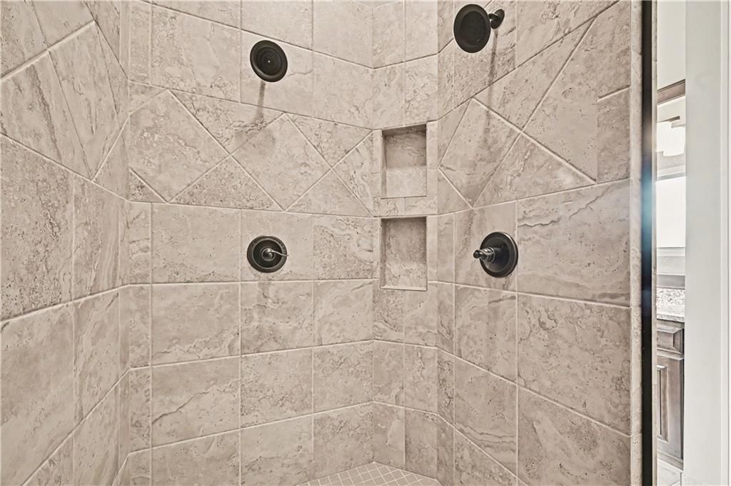 Walk-in shower and tiled shower at 10812 W 153rd Street, Overland Park, KS 66221