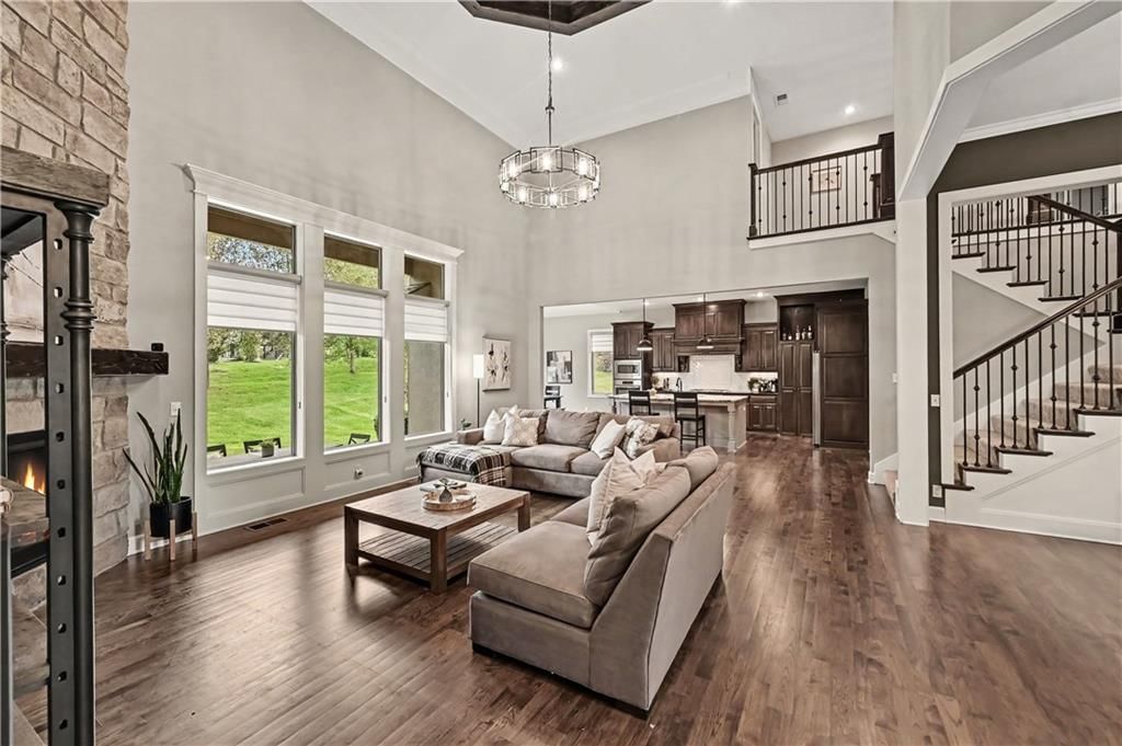 Tall ceilings, open floor plan and statement lighting at 10812 W 153rd Street, Overland Park, KS 66221