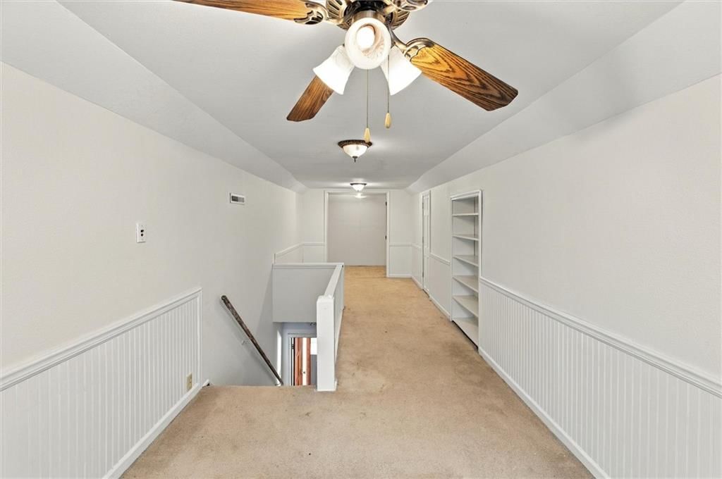 Wainscoting or board and batten, shiplap / paneling and staircase at 1504 9th Avenue, Leavenworth, KS 66048