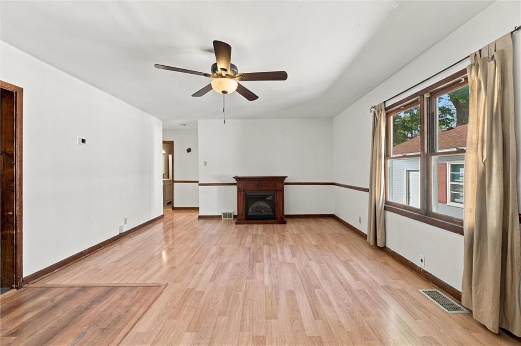 Fireplace, white trim and white walls at 1504 9th Avenue, Leavenworth, KS 66048