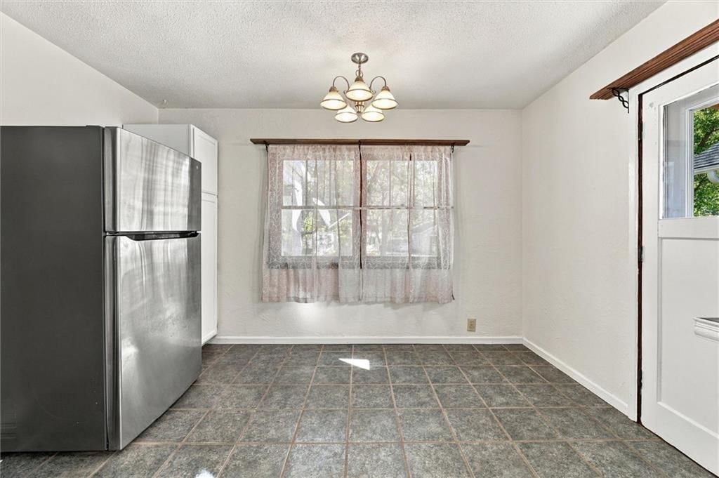 Stainless steel appliances and breakfast nook at 1504 9th Avenue, Leavenworth, KS 66048