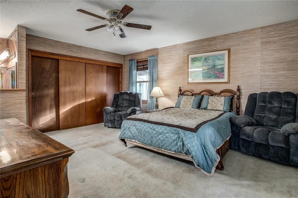 Bedroom sitting area and walk-in closet at 9007 E 68th Street, Raytown, MO 64133
