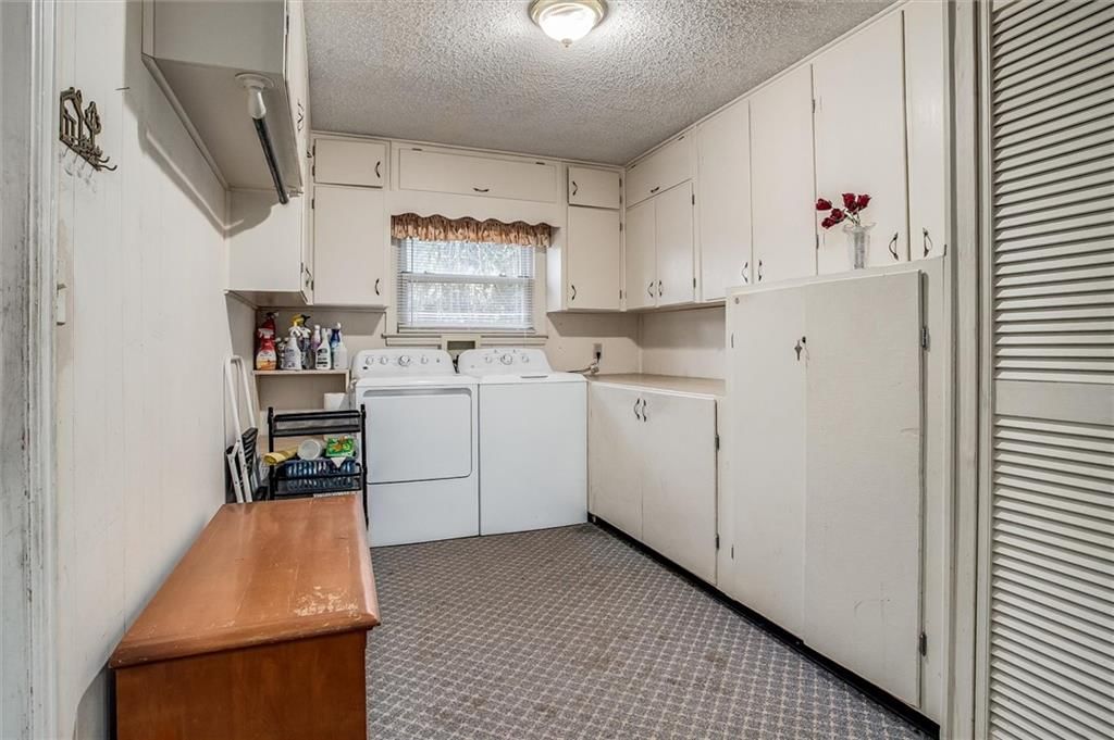 White kitchen and white appliances at 9007 E 68th Street, Raytown, MO 64133