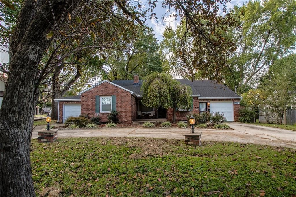Mature trees at 9007 E 68th Street, Raytown, MO 64133