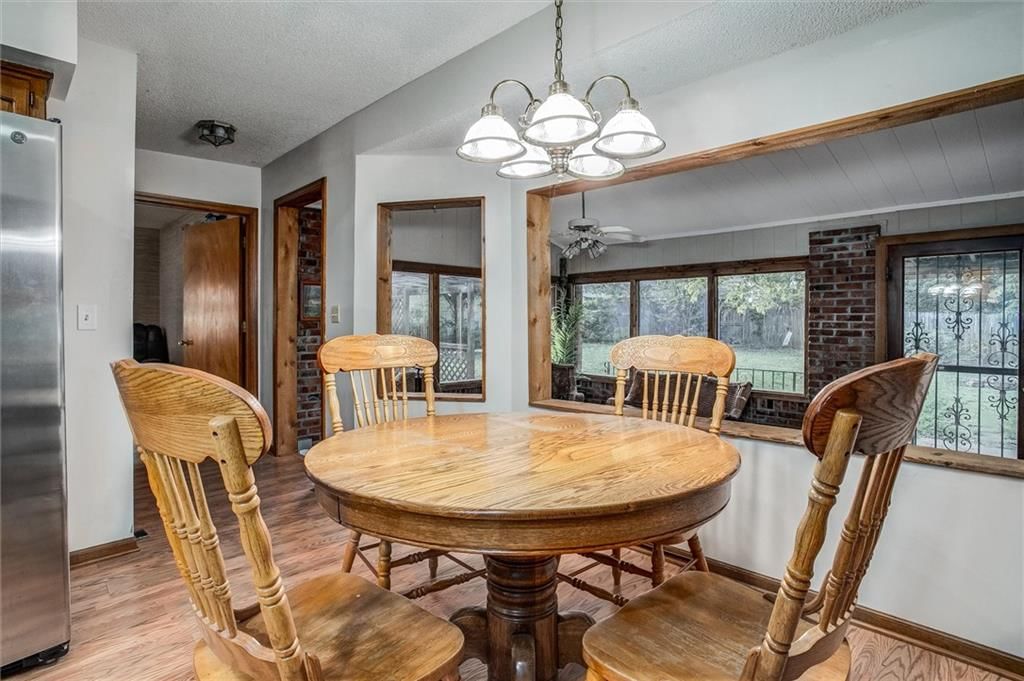 Tall ceilings, fireplace and brick fireplace at 9007 E 68th Street, Raytown, MO 64133