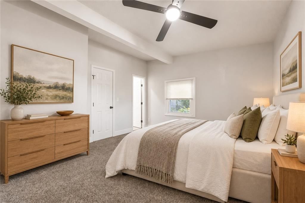 Main-floor primary bedroom and carpet at 3426 Cypress Avenue, Kansas City, MO 64130
