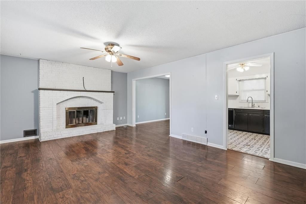 Fireplace, hardwood floors and brick fireplace at 2206 Wilson Avenue, Leavenworth, KS 66048