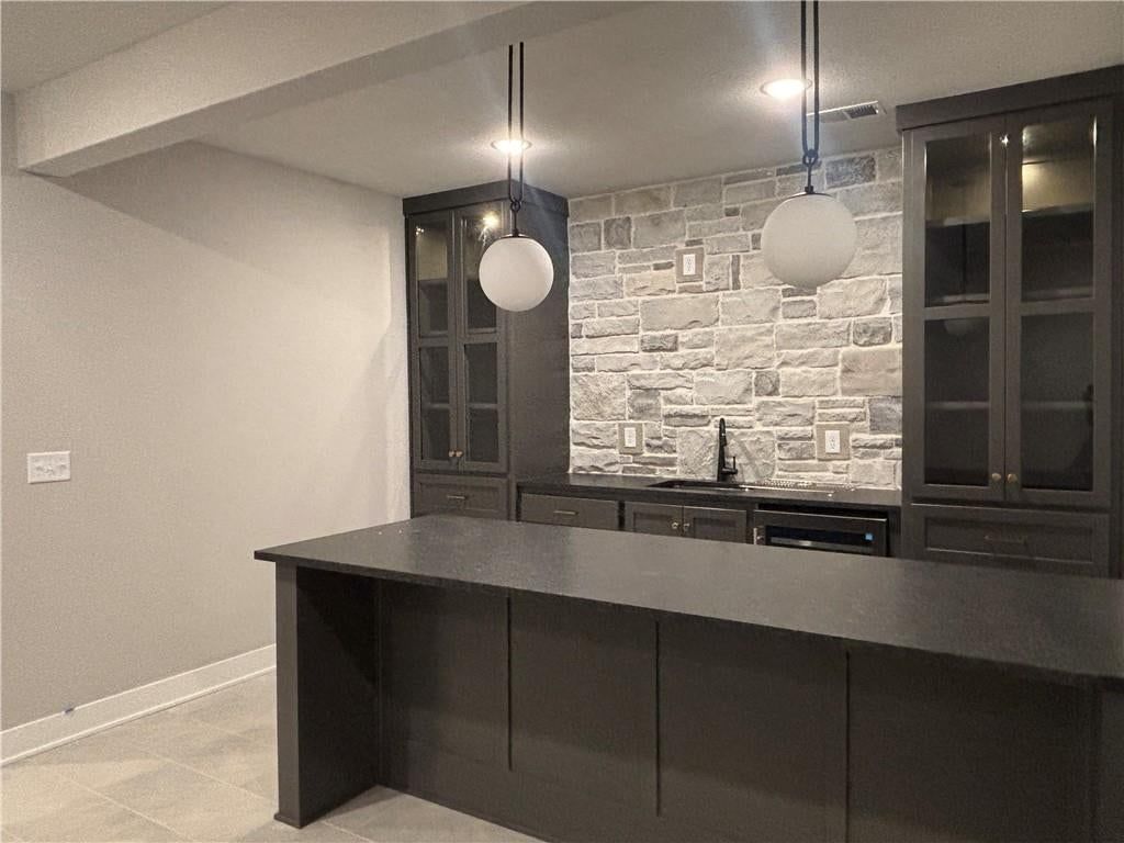 Finished basement and wet bar at 1820 SW Arbormist Drive, Lee's Summit, MO 64082