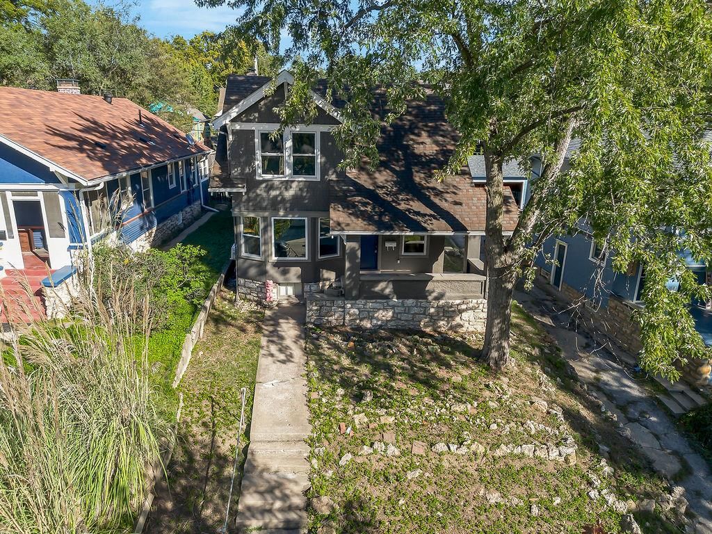 Fenced yard and mature trees at 4217 Holmes Street, Kansas City, MO 64110