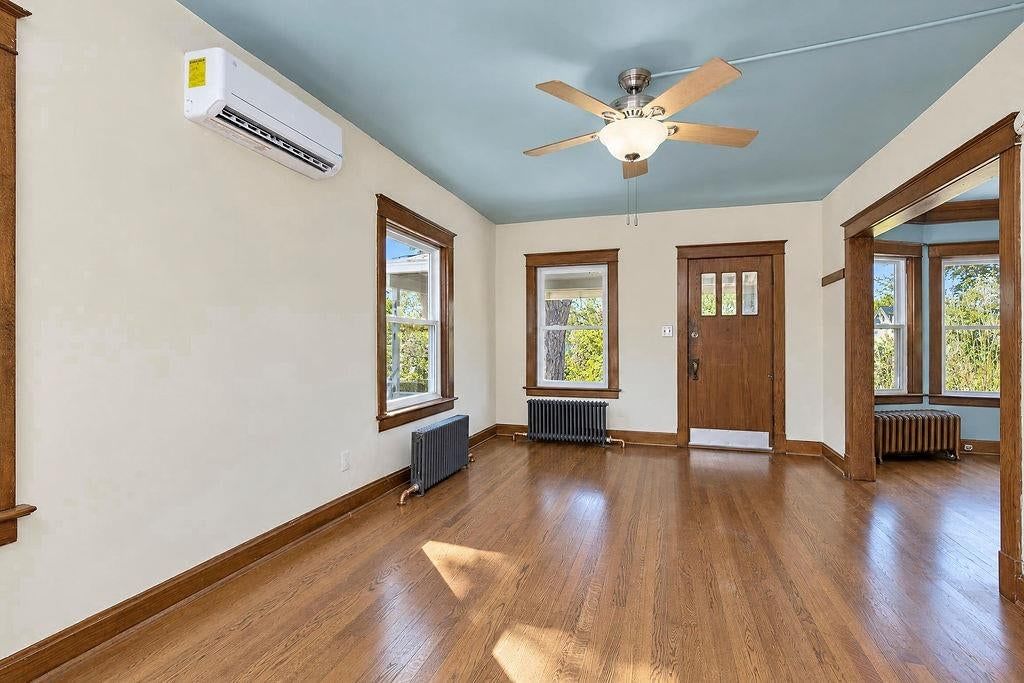 Hardwood floors, statement lighting and recessed lighting at 4217 Holmes Street, Kansas City, MO 64110