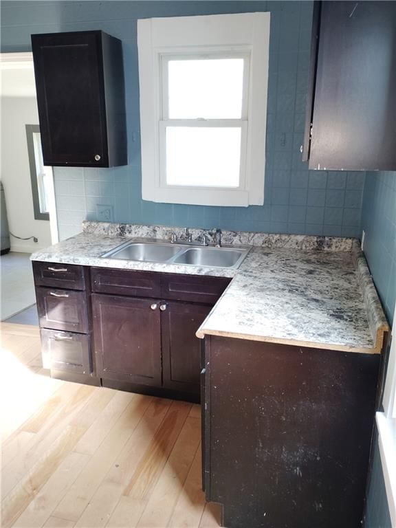 Hardwood floors, kitchen backsplash and white trim at 3421 Flora Avenue, Kansas City, MO 64109