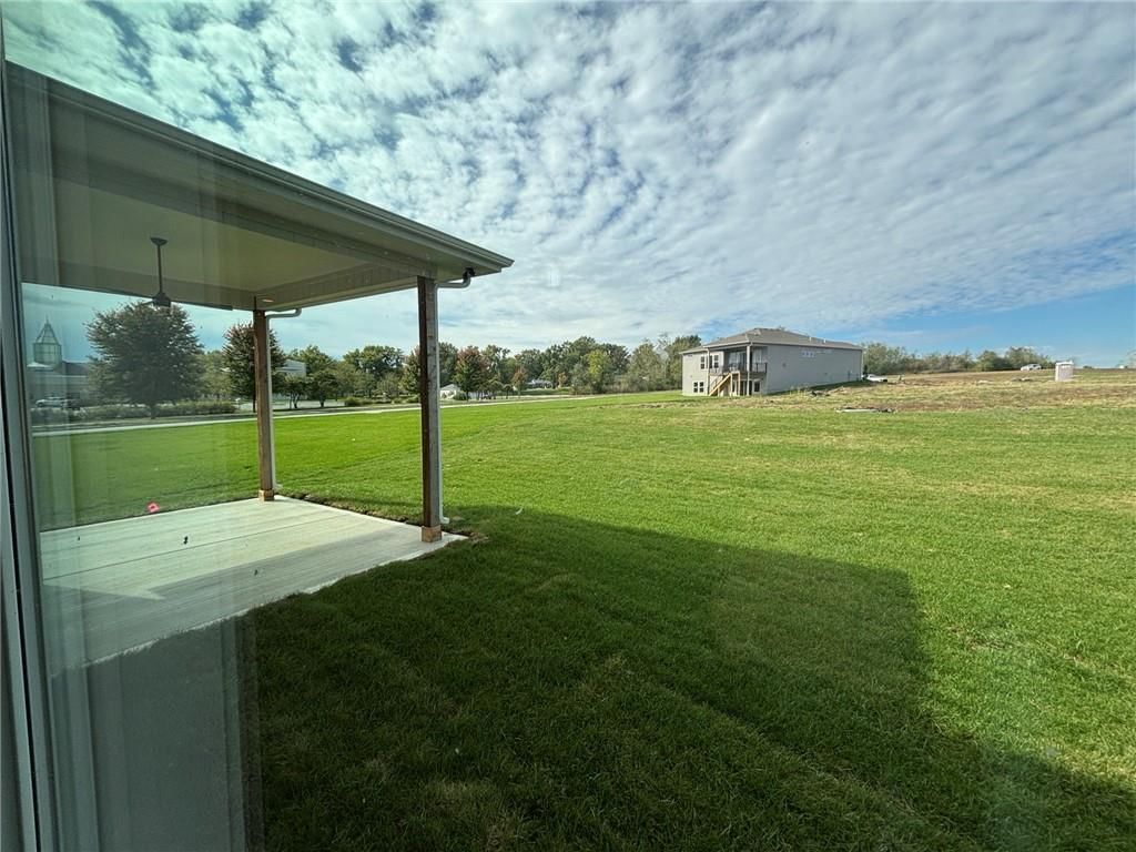 Big backyard, covered patio and flat lot at 1816 SW Arbormist Drive, Lee's Summit, MO 64082
