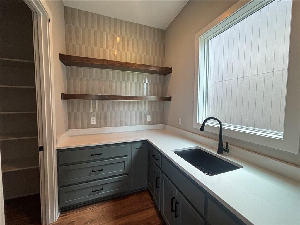 Walk-in shower, tiled shower and double vanity at 1816 SW Arbormist Drive, Lee's Summit, MO 64082