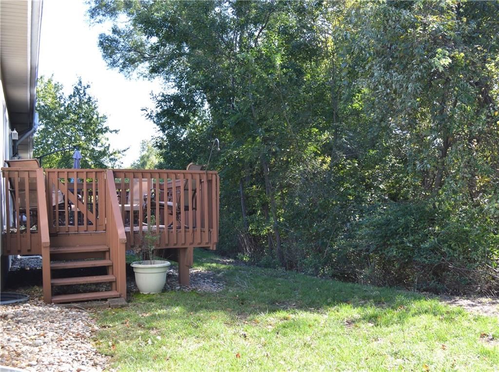Deck, mature trees and wood deck at 3101 NE 63 Terrace, Gladstone, MO 64119