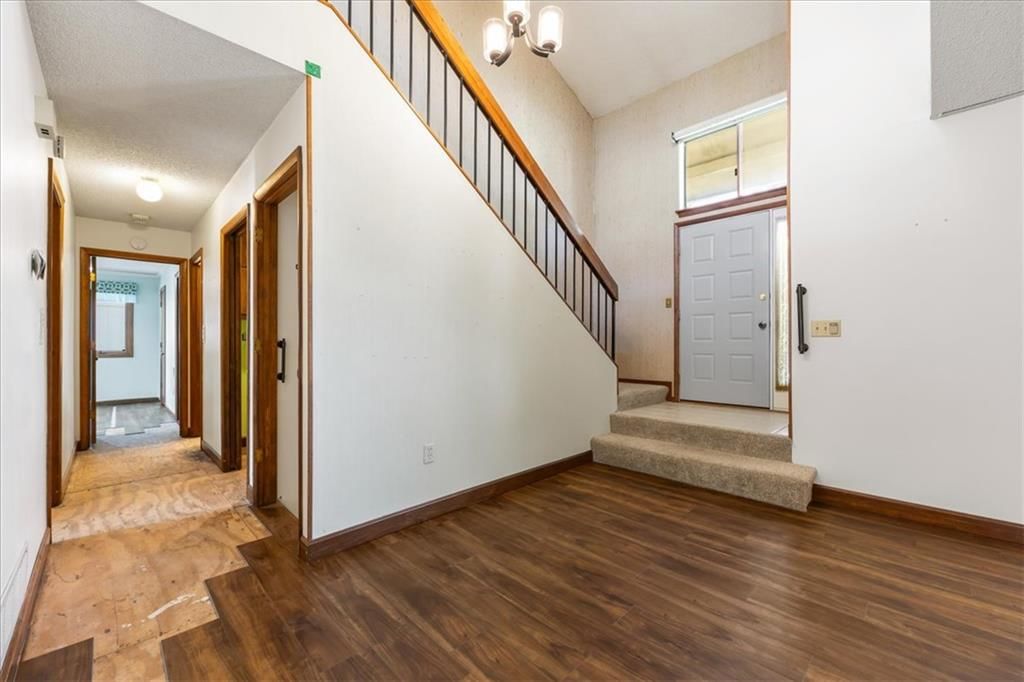 Staircase and wood stair railing at 14705 W 91st Place, Lenexa, KS 66215