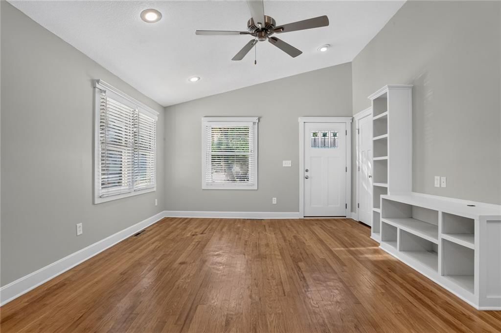 Hardwood floors, recessed lighting and white trim at 5404 NE 43rd Street, Kansas City, MO 64117
