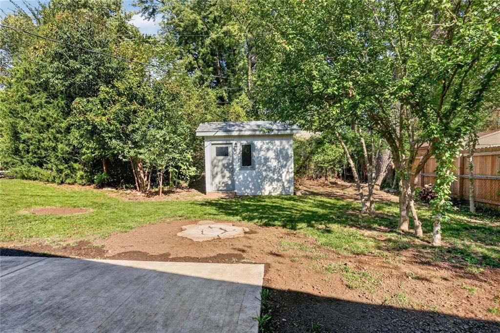 Fenced yard, wood fence and concrete patio at 5404 NE 43rd Street, Kansas City, MO 64117