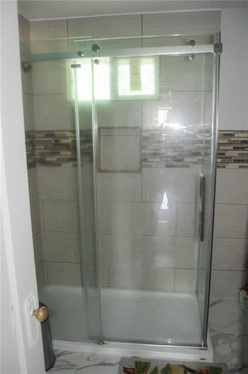 Walk-in shower and frameless glass shower at 2503 Grandview Boulevard, Kansas City, KS 66102