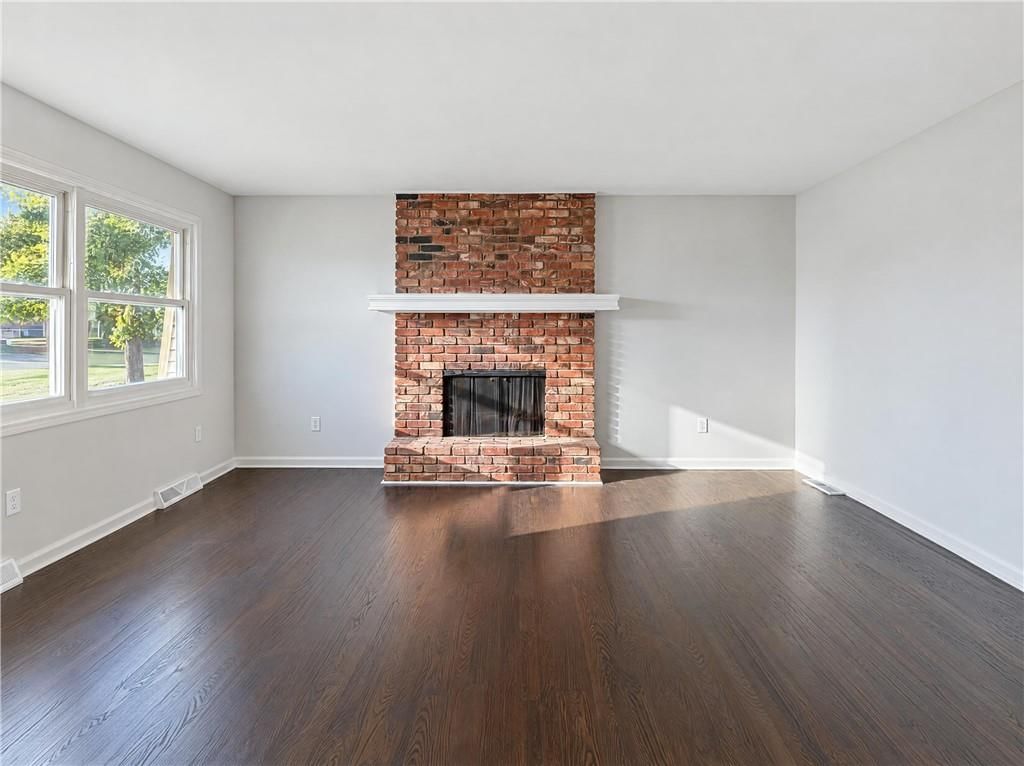 Fireplace and brick fireplace at 1400 NW 65th Terrace, Kansas City, MO 64118