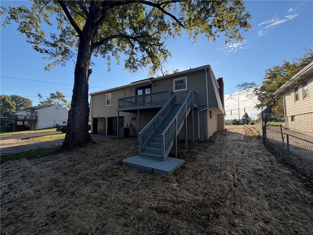 Big backyard and mature trees at 1400 NW 65th Terrace, Kansas City, MO 64118