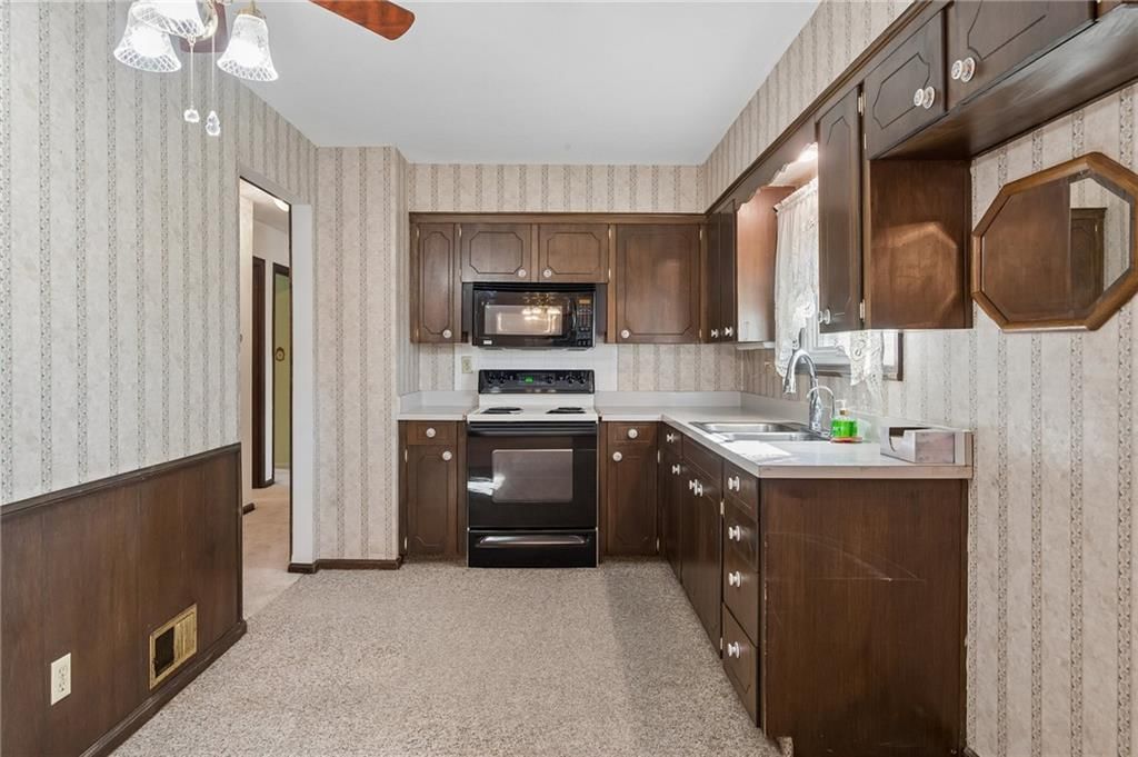 Second kitchen, stainless steel appliances and electric range at 7413 NW 84th Terrace, Kansas City, MO 64153