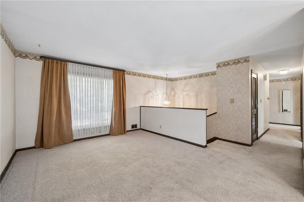 Wall of windows and recessed lighting at 7413 NW 84th Terrace, Kansas City, MO 64153