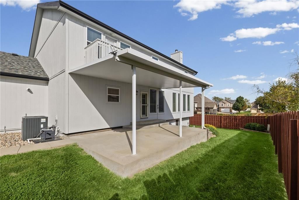 Covered patio and concrete patio at 1703 NE 181st Terrace, Smithville, MO 64089