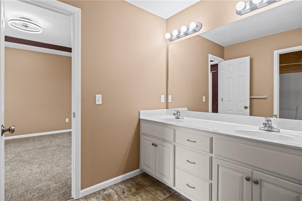 Double vanity and white vanity at 1703 NE 181st Terrace, Smithville, MO 64089