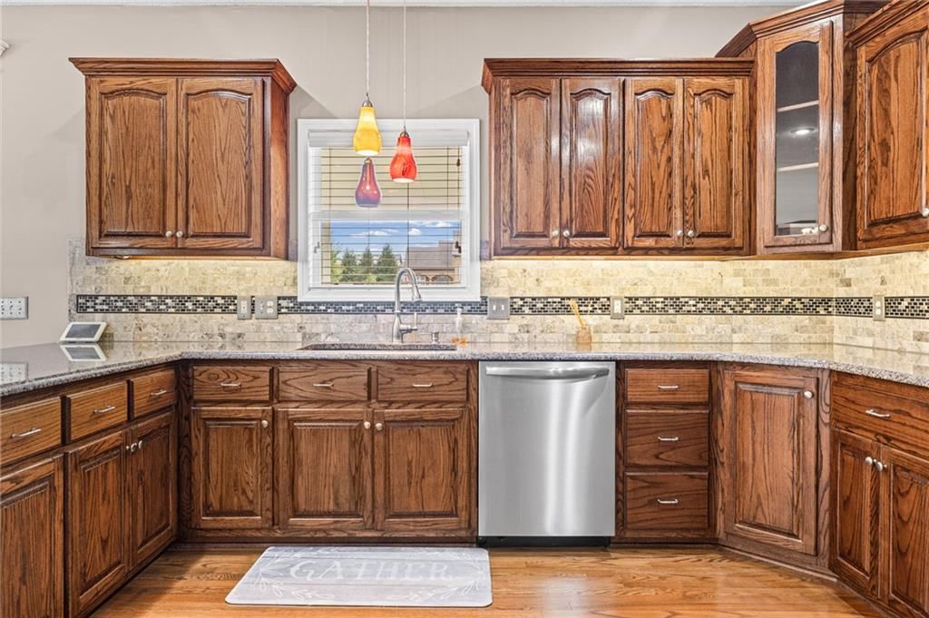 Granite counters, kitchen backsplash and mosaic tile backsplash at 1703 NE 181st Terrace, Smithville, MO 64089