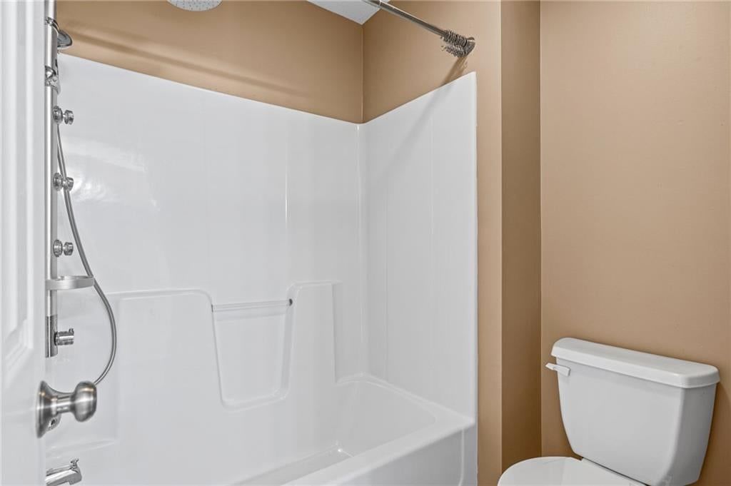 Tiled shower and tub and shower combo at 1703 NE 181st Terrace, Smithville, MO 64089