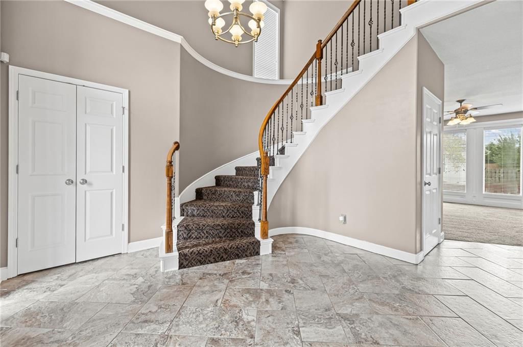 Statement lighting, wainscoting or board and batten and tile floors at 1703 NE 181st Terrace, Smithville, MO 64089