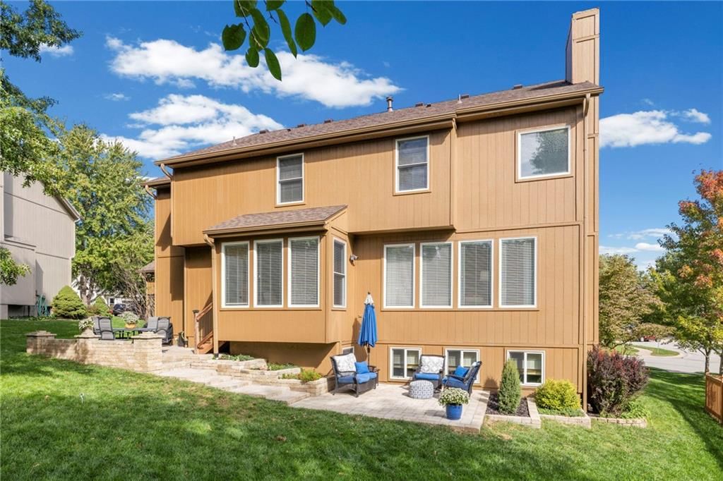 Deck, big backyard and mature trees at 22007 52nd Street, Shawnee, KS 66226