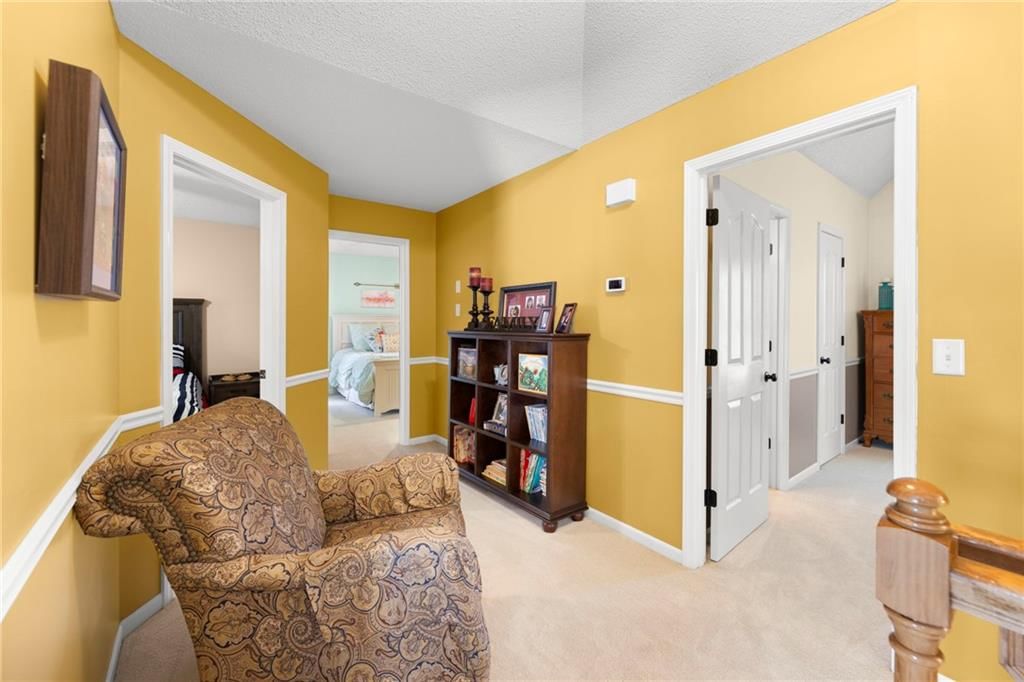Yellow main wall color and carpet at 22007 52nd Street, Shawnee, KS 66226